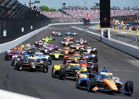 Indianapolis 500 with cars and crowds