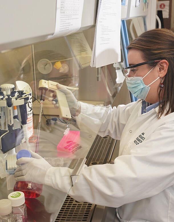 Scientist Anna Geisinger working with cells